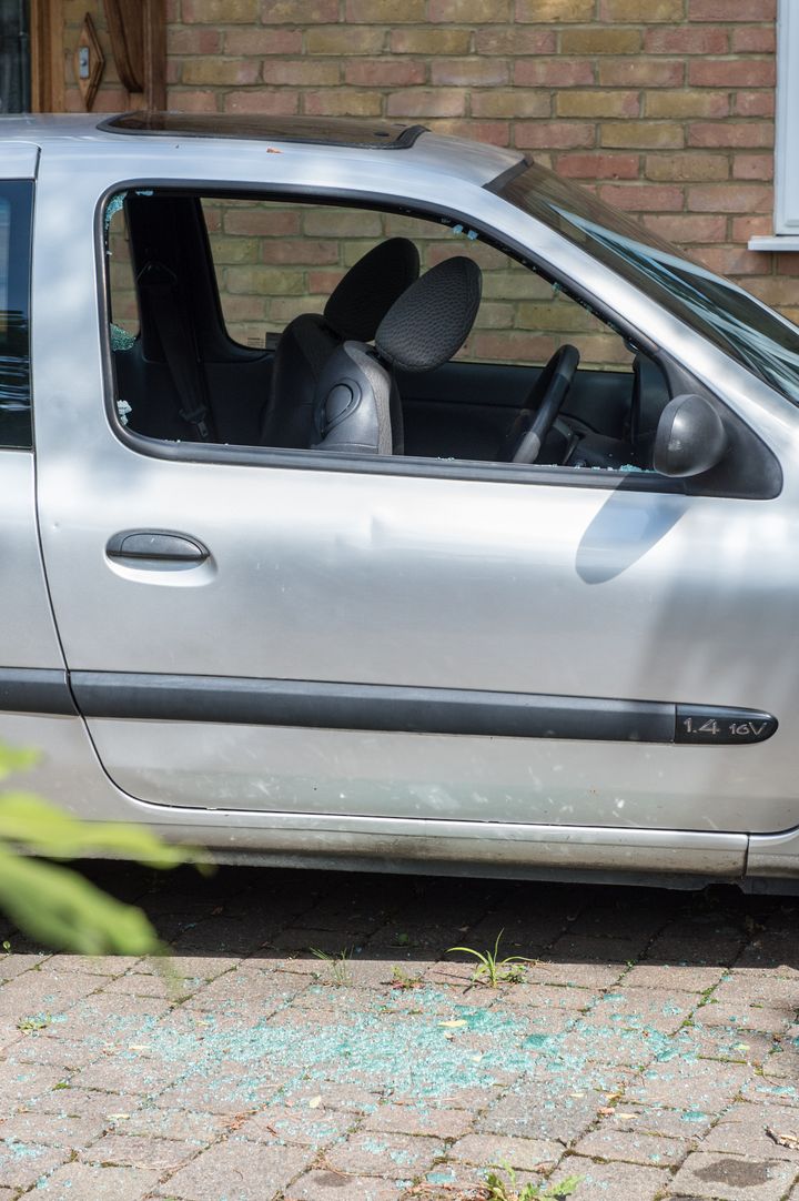 Renault Clio with a smashed driver's side window out side of the home where teenage girl's body was found.