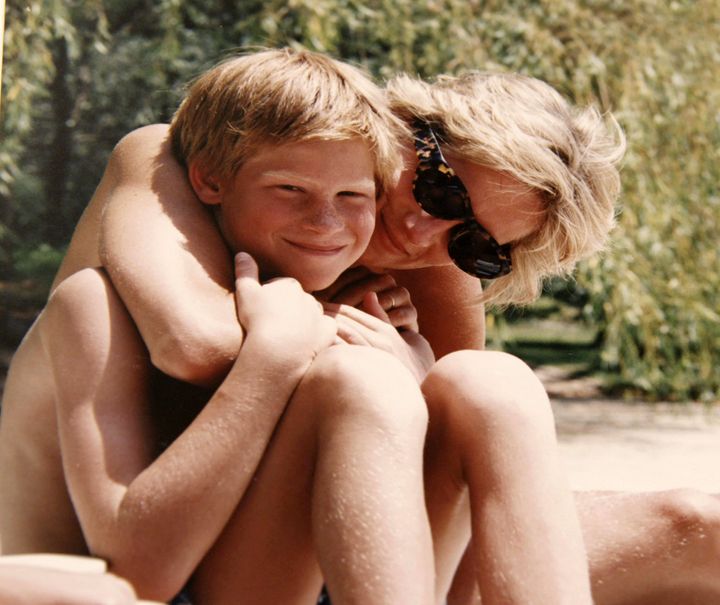 Prince Harry cuddles with his mother in a never before seen photo from the royal picture album 