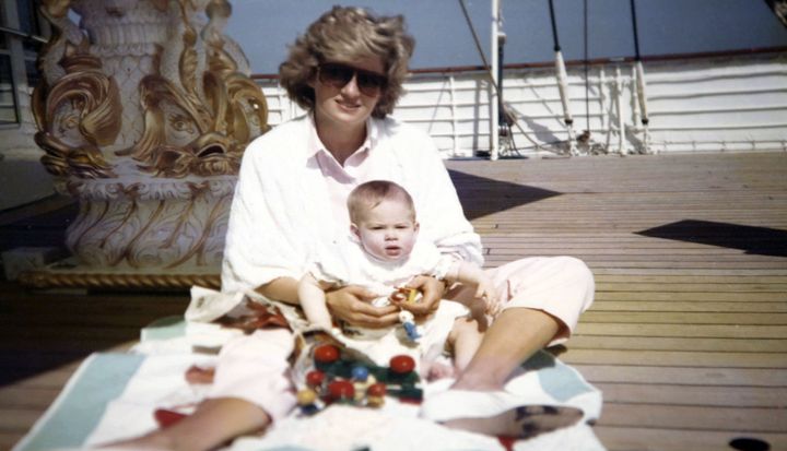Princess Diana playing with Prince Harry aboard the Royal Yacht Britannia in a photograph taken by Prince William