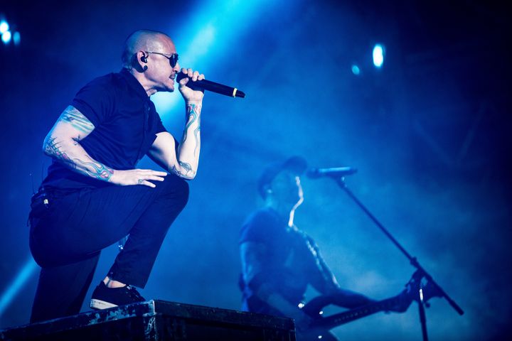 Chester performing with the band in Italy last month 