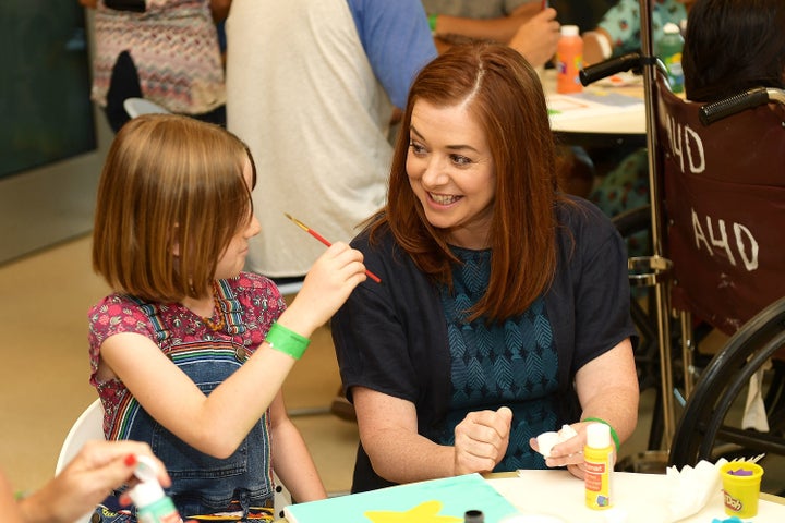 Hannigan and her daughter, Satyana, spent time with kids at LAC+USC Medical Center with Starlight Children's Foundation. 