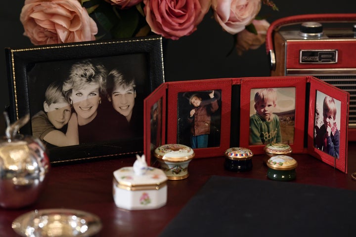 Photos of Princes William and Harry sit atop the desk Princess Diana used at Kensington Palace.