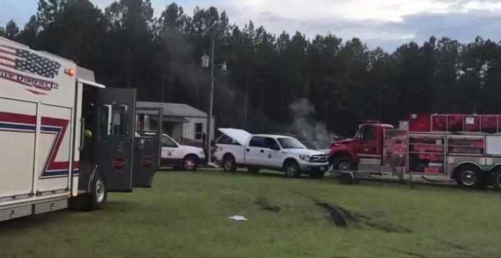 Emergency vehicle are seen at the location of the July 14 fire.