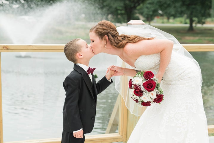 Such a sweet shot of the bride and her stepson. 