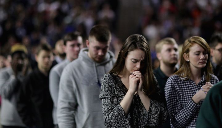 Evangelical support has pushed the Republican Party toward theocracy. Here, students at Liberty University pray for Donald Trump before his inauguration.