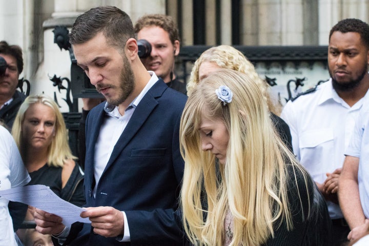 <strong>Charlie's parents Chris Gard and Connie Yates deliver a statement outside the High Court on Monday after ending their legal challenge</strong>