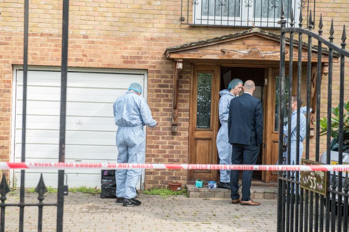 Police forensics at the home where the teenager's body was found 