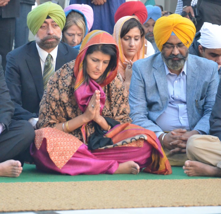 Nikki Haley, who was brought up in the Sikh tradition but now identifies as Christian, pays obeisance at the Golden Temple in Amritsar, India, on Nov. 15, 2014.