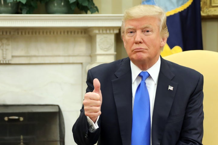 U.S. President Donald Trump reacts as he meets with Lebanese Prime Minister Saad al-Hariri (not pictured) in the Oval Office of the White House on July 25, 2017.