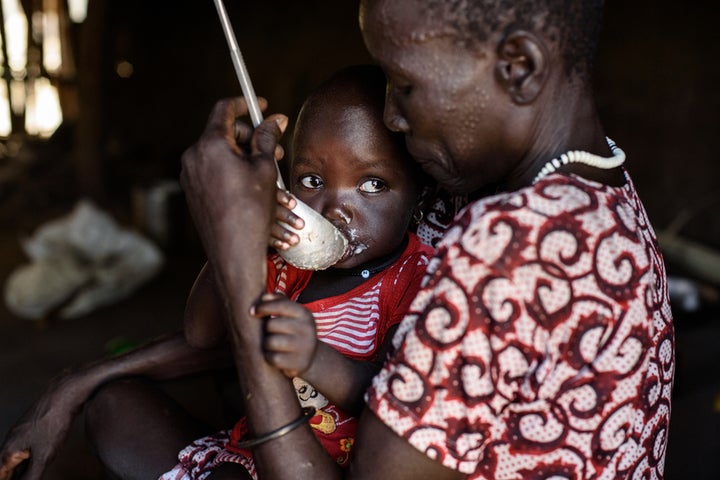 April 2017, South Sudan. Angelina Nyadechni Kai supports a family of eight. They fled from Myandit because of fighting. Before they began receiving food distributions, they collected and ate water lilies. Mercy Corps is providing lifesaving clean drinking water, supporting hygiene and sanitation needs to prevent disease, as well as providing vegetable, fishing and staple crop kits. 