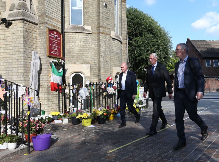 Sir Martin Moore-Bick (centre) arrives to speak to Grenfell Tower residents at Notting Hill Methodist Church in Notting Hill, London.