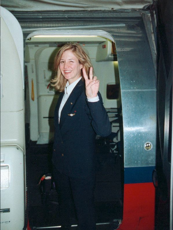Christine as a flight attendant.