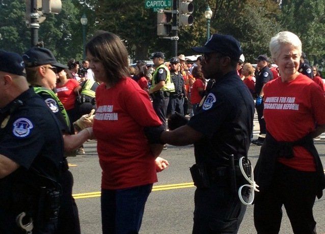 <p>Heather Booth (right) being arrested during an immigrant rights protest in Washington, D.C., 2013</p>