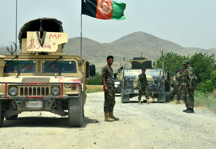 Afghan National Army soldiers patrol the Shah Wali Kot district of Kandahar province in this May 2017 file photo. At least 30 soldiers were killed in an attack on the army base on Wednesday.