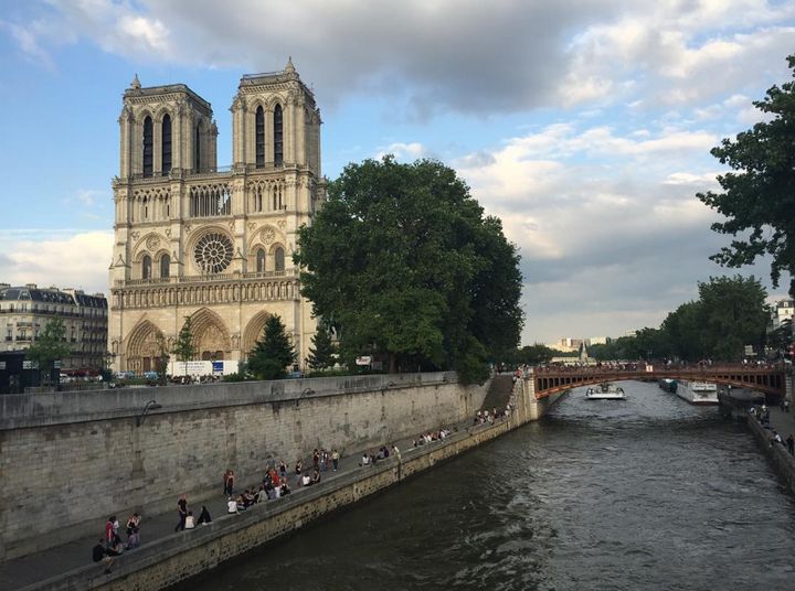 Walking along the Seine and ran into Notre Dame. Location: Paris, France