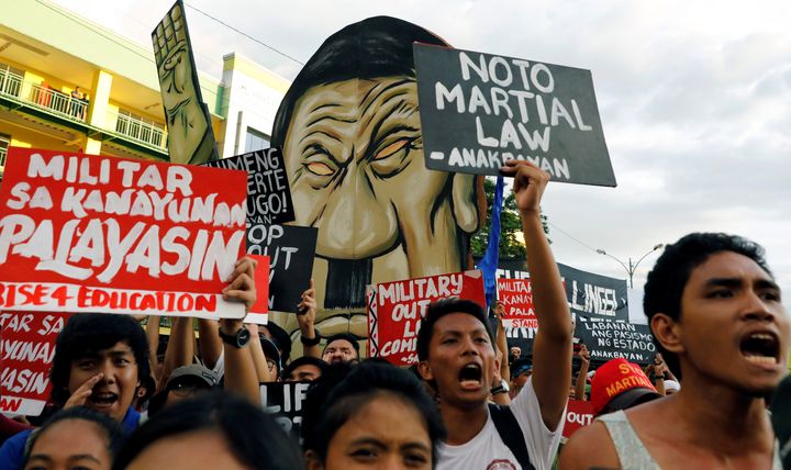 Protesters chant slogans as Philippine President Rodrigo Duterte delivers his State of the Nation address at the Congress in Quezon city, Metro Manila Philippines July 24, 2017. 