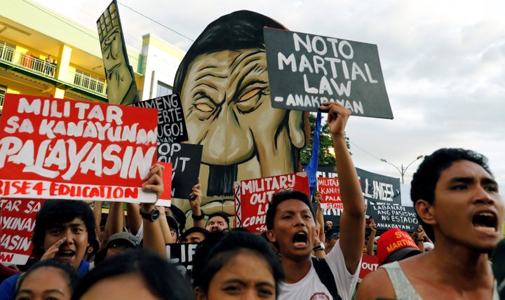 Protesters chant slogans as Philippine President Rodrigo Duterte delivers his State of the Nation address at the Congress in Quezon city, Metro Manila Philippines July 24, 2017. 