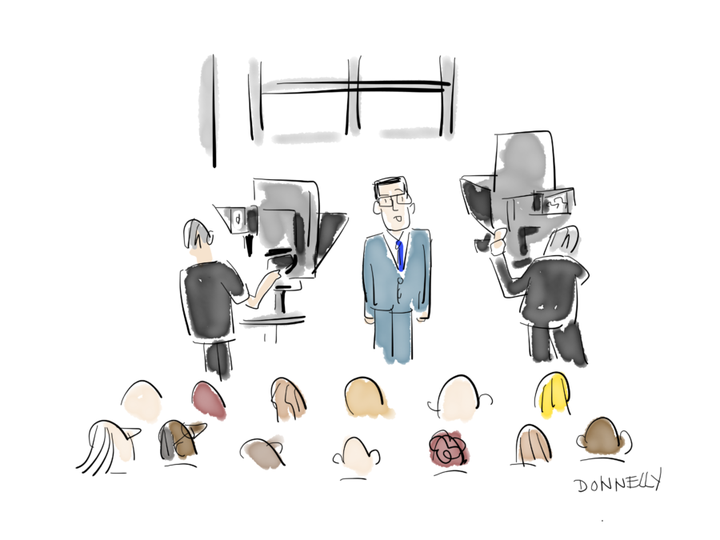 Colbert with cameras and audience.