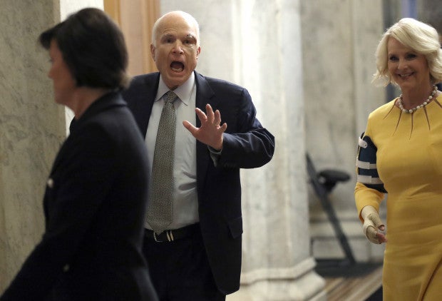 <em>John McCain returns to Senate with his wife Cindy to cast deciding vote to move forward with Obamacare repeal</em>
