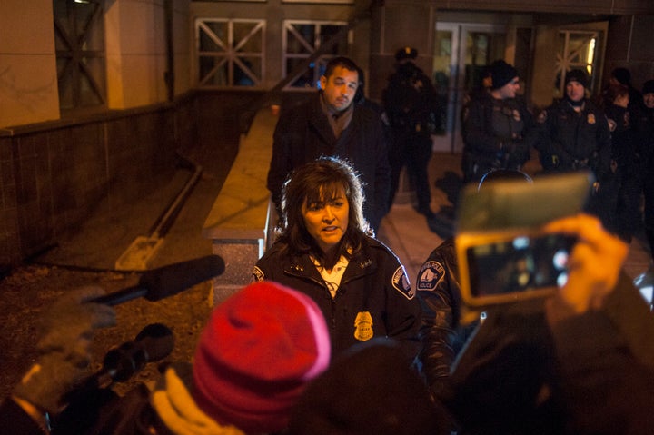 Minneapolis Police Chief Janee Harteau speaks with protesters behind a barricade outside Nov. 20, 2015, over the shooting death of Jamar Clark by a police officer. 