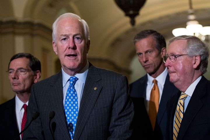Senate Majority Whip John Cornyn (second from left) said Wednesday that Senate Republicans' "skinny repeal" plan would be a vehicle to go to a conference committee with the House -- and then later said the House could just pass whatever plan the Senate agrees to.