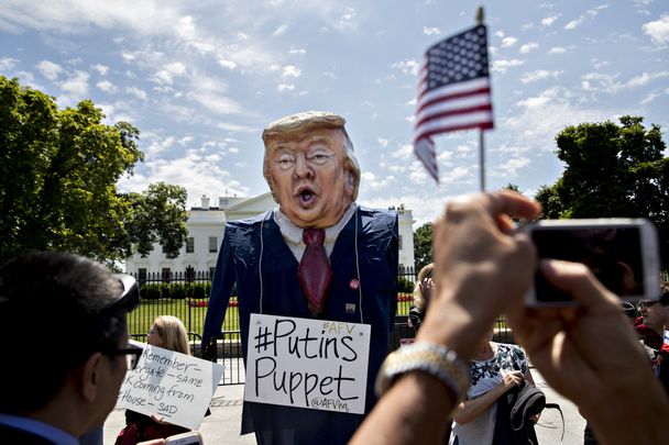 A demonstrator wears an effigy in the likeness of U.S. President Donald Trump with a sign that reads "Putins Puppet" during a protest outside the White House in Washington, D.C., U.S., on Wednesday, May 10, 2017. Russian Foreign Minister Sergei Lavrov arrived at the White House Wednesday for a meeting with Trump the day after the U.S. president fired the FBI director who had been leading an investigation into possible Trump campaign collusion with Russian officials. Photographer: Andrew Harrer/Bloomberg via Getty Images