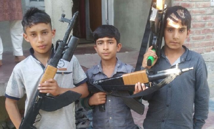 Kashmiri Children with toy guns in their hands.