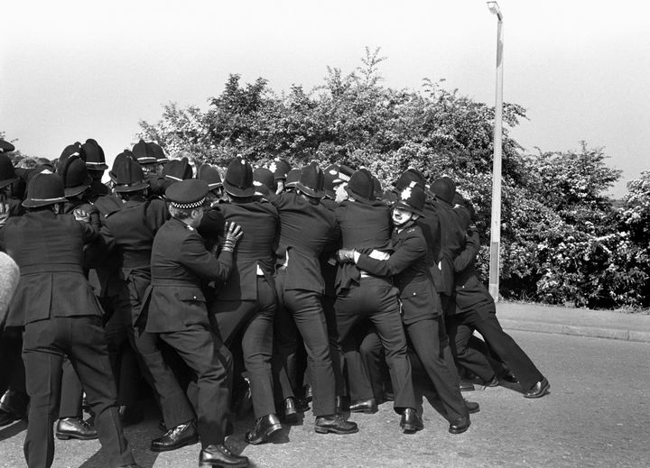 A police line holds back miner's pickets at clashes at the Orgreave Coking Plant near Rotherham in 1984.