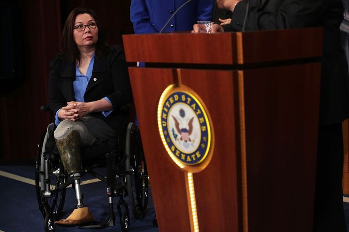Sen. Duckworth listens during a news conference on April 27, 2017.