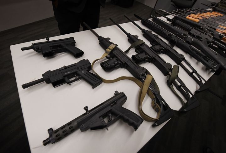Assault rifles and two rocket propelled grenade launchers on display at a press conference to show the results of an anonymous gun buyback program at Police headquarters in Los Angeles, California on May 19, 2017.