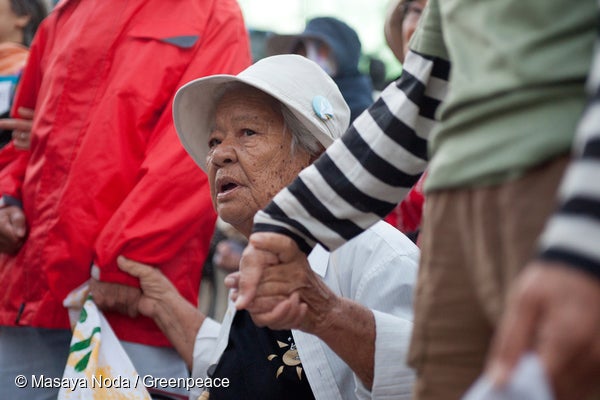Elderly woman protesting the planned expansion of a U.S. military base at Camp Schwab.