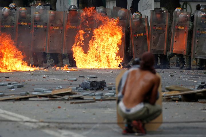 Demonstrators clash with riot security forces at a rally in Caracas, Venezuela, on July 26.