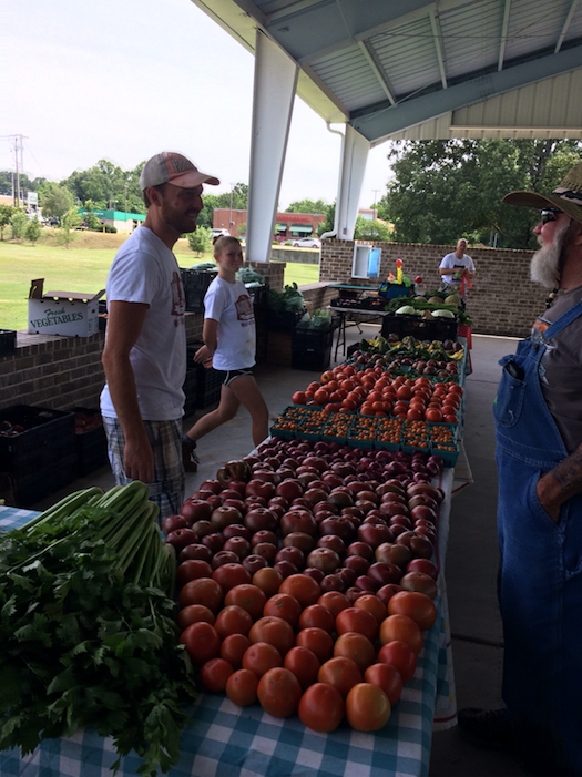 Farmers selling produce at the Market, May 2017