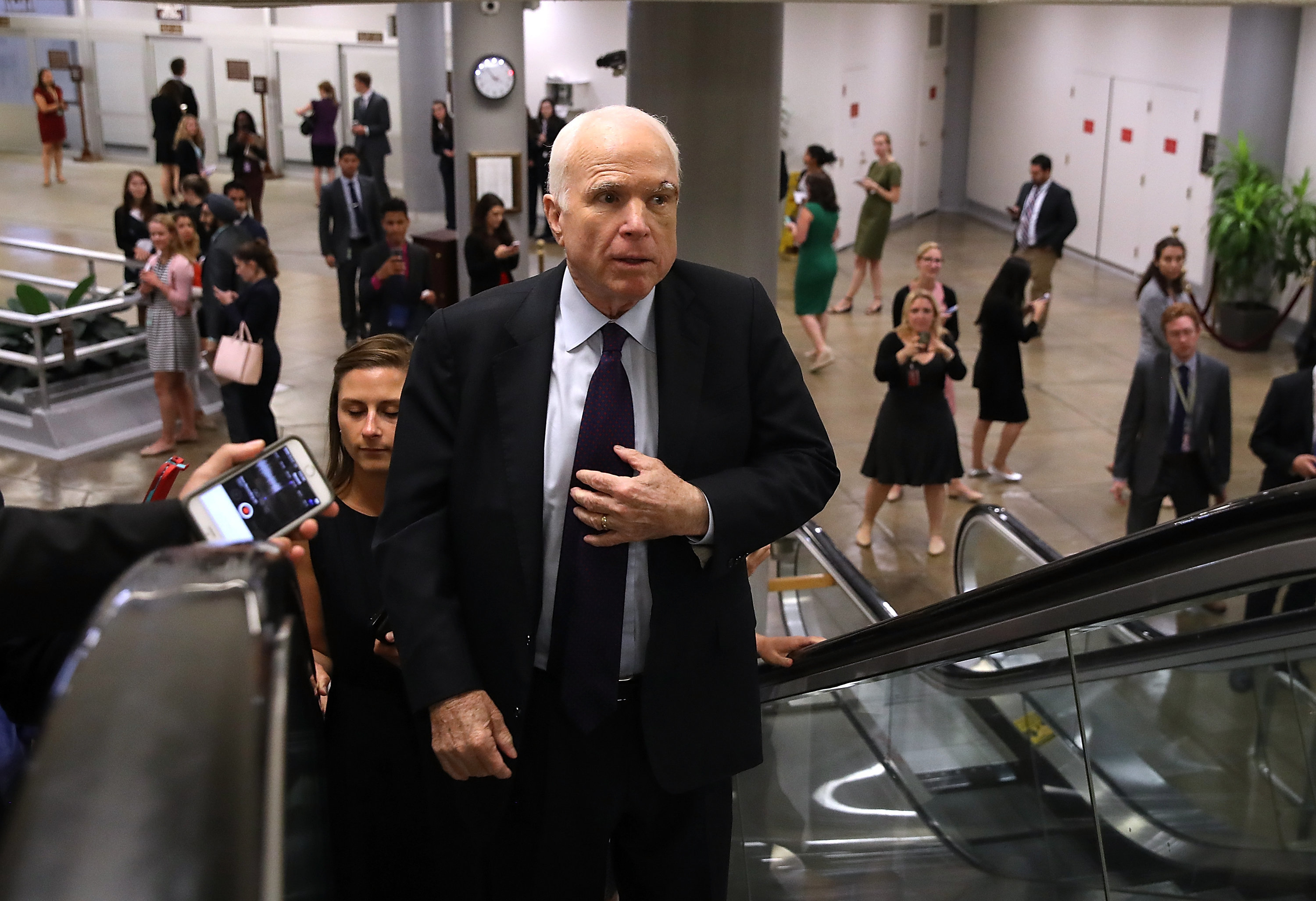 McCain returns home for cancer treatment