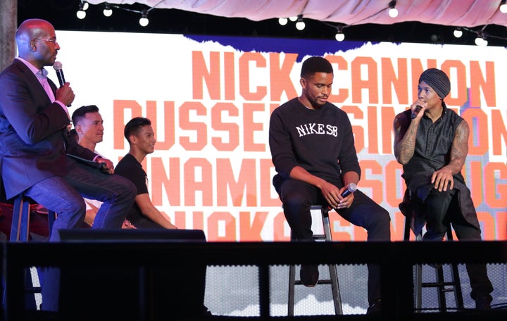 Van Jones, former NFL cornerback Nnamdi Asomugha and actor-comedian Nick Cannon talk politics at the Hollywood Palladium in Los Angeles on July 26.