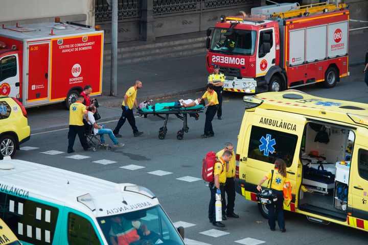 Medics rush injured passengers to waiting ambulances 