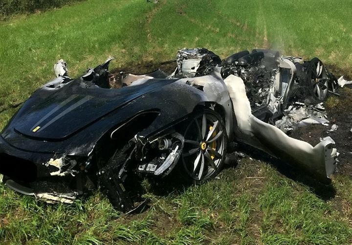 The car left the road in wet conditions and slid across a field before bursting into flames 
