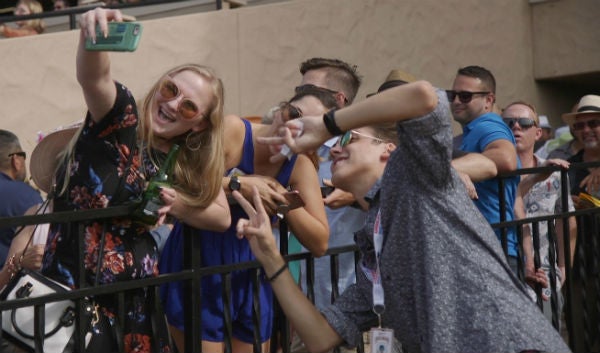 Matthew being Matthew with a fan at Del Mar Racetrack