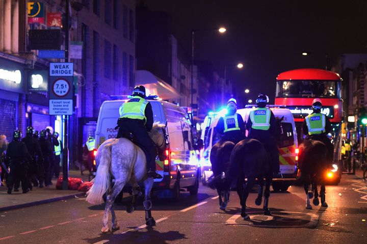 Riot police at the scene on Friday