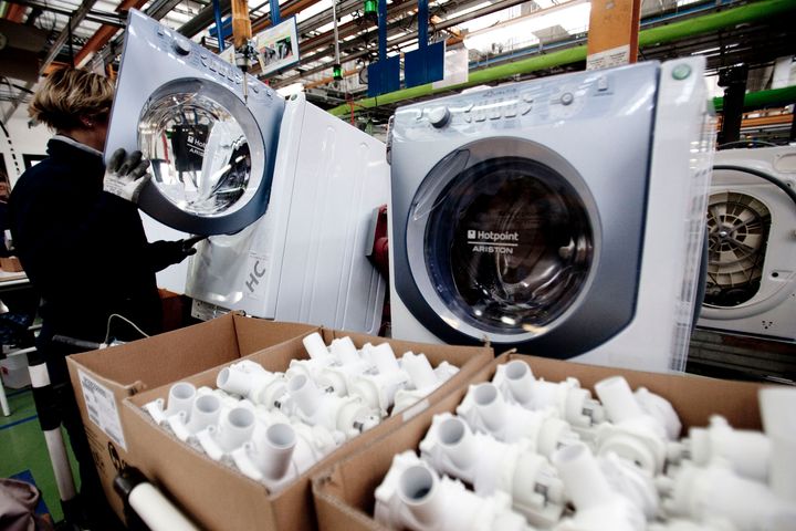 An Indesit Company SpA employee assembles a washing machine at the company's factory in Comunanza, Italy. White goods are one of the key exports from Italy to the UK.