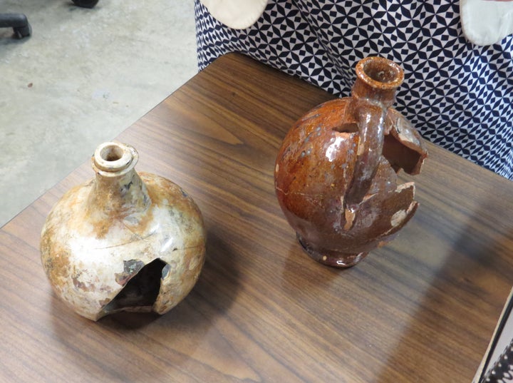 <p> <em>Found at the Stadt Huys site, a redware pitcher and a glass bottle that were likely hefted by New Amsterdam serving maids, the original New York City waitresses. The locally-made pottery pitcher, modeled on Dutch prototypes, held locally-brewed ale or cider. The glass decanter, an elite object imported from Europe, held imported wine. It was likely used by New Amsterdam’s political elite when attending to official business. Kitchen work and serving were two of the limited options of work for New Amsterdam women.</em> </p>