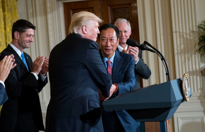 Foxconn and U.S. Chief Executives joined by Paul Ryan celebrate the deal. Are they sharing a laugh at the expense of American