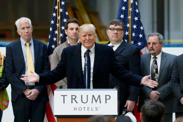 Then-presidential candidate Donald Trump speaks to the media during a news conference at the construction site of the Trump I
