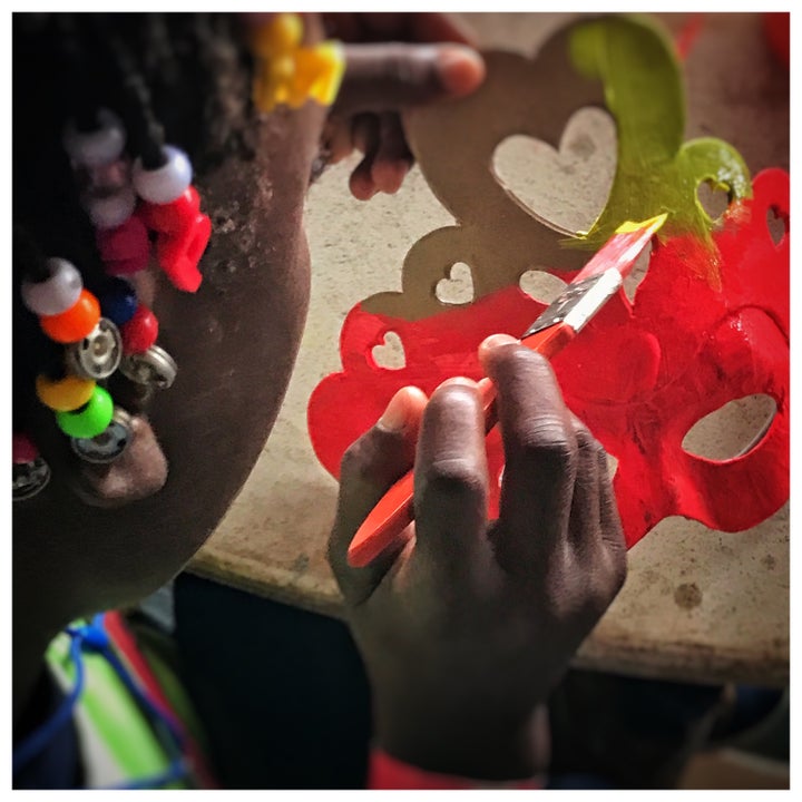 A camper hard at work on her superhero mask, Kan Etwal, Kenscoff, Haiti.