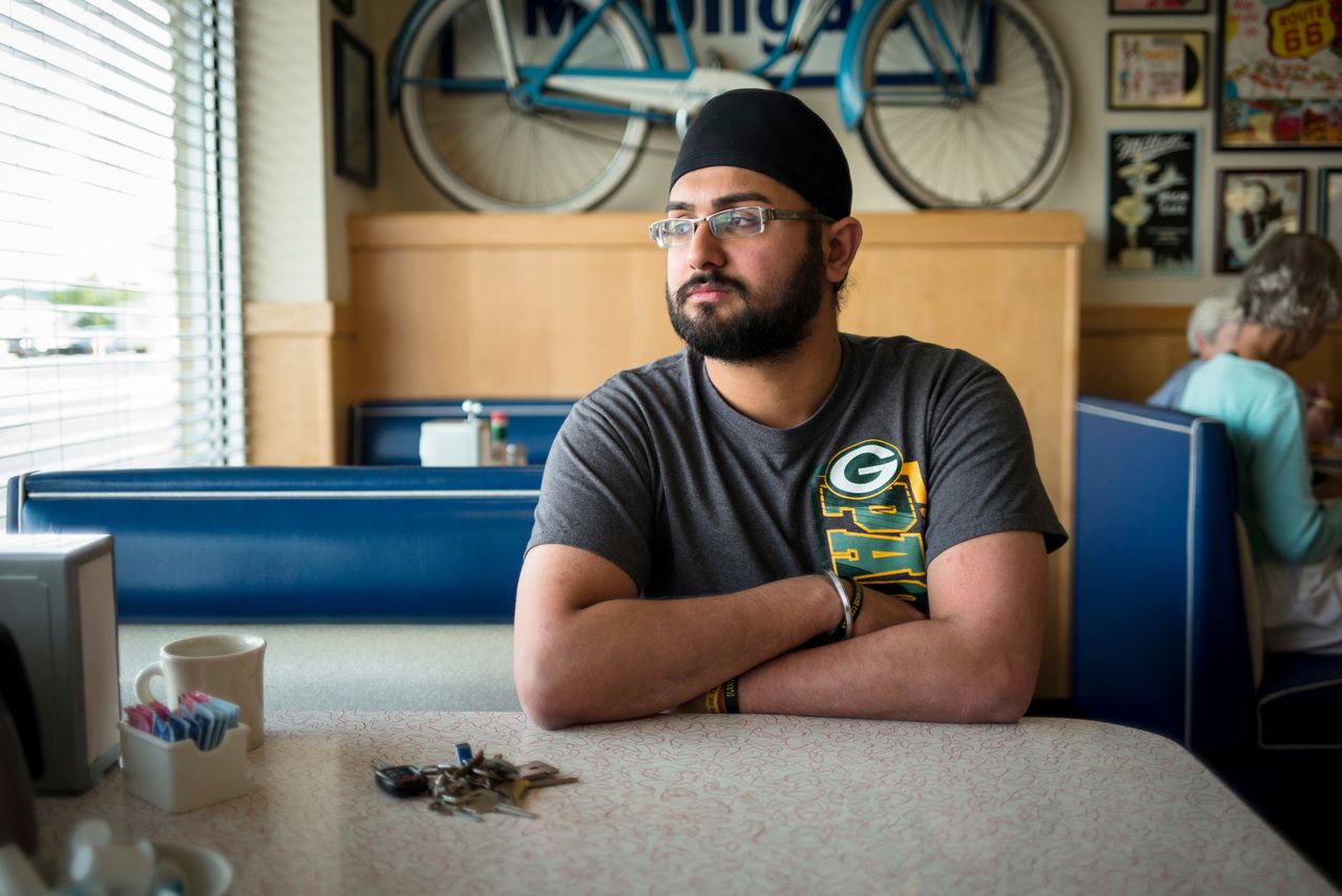Harpreet Singh Saini, who lost his mother in the Oak Creek massacre, sits in the Douglas Avenue Diner in Racine, Wisconsin.