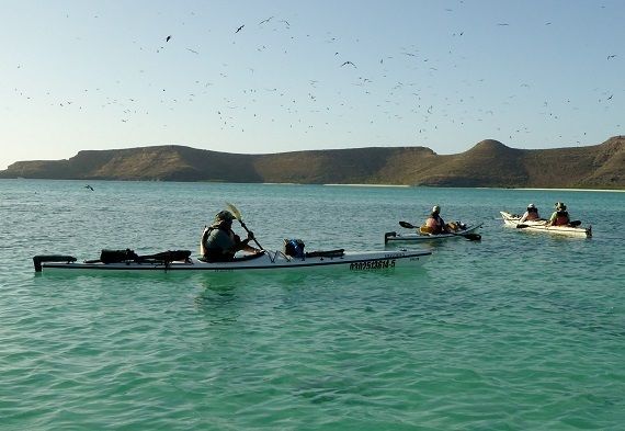 Kayakers paddle to one of La Paz’s offshore islands.