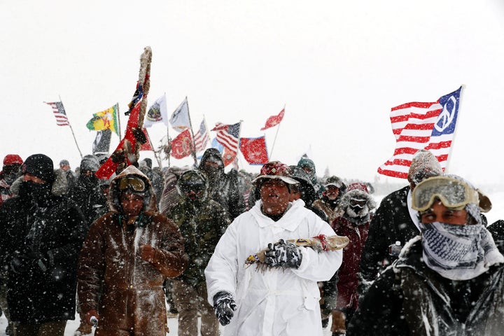 Veterans and other activists march in December 2016 against plans to pass the Dakota Access pipeline adjacent to the Standing