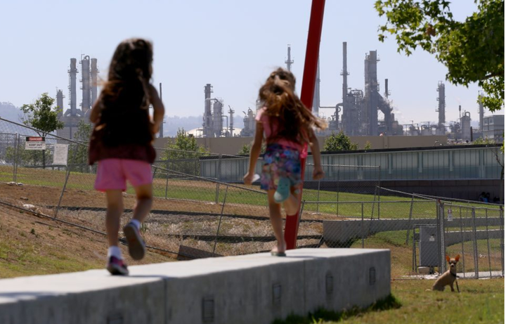 Children at play in Wilmington, California—their neighborhood is adjacent to a major cluster of industry.
