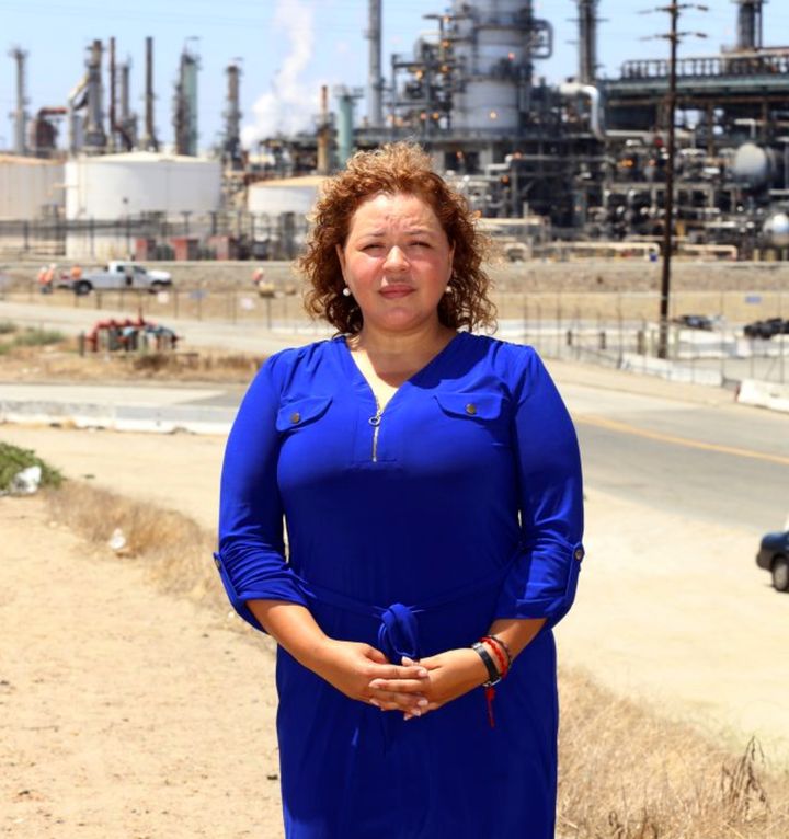 Magali Sanchez-Hall in front of the Tesoro refinery near her home.