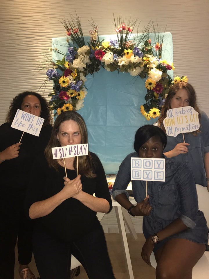 Riley Andreu, who helped organize the shower, created photo booth signs that included sayings like, "I woke up like this" and #slay."